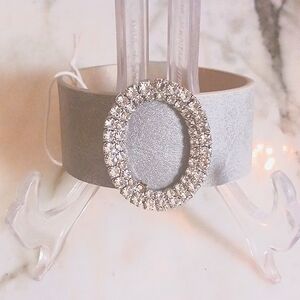 NWT GRAY FAUX LEATHER WRAP BRACELET WITH OVAL CHARM AND CLEAR RINESTONES